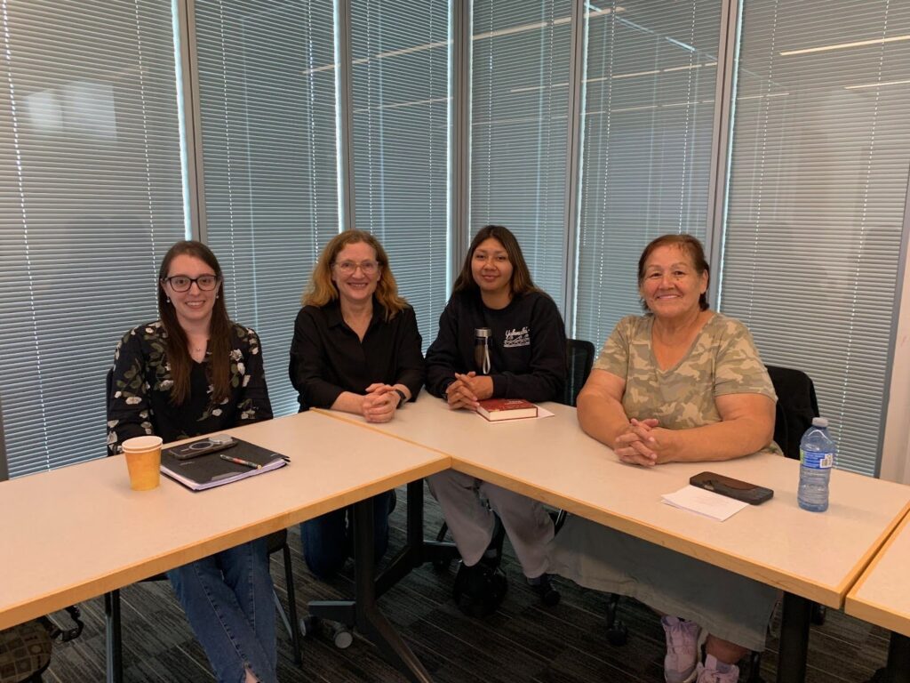 Theresa and Victoria Johnson sitting with Andrea Smith and Katelyn Lucas.
